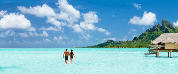 destination-tahiti-hero-couple-overwater-bungalow-bora-bora-2000x837